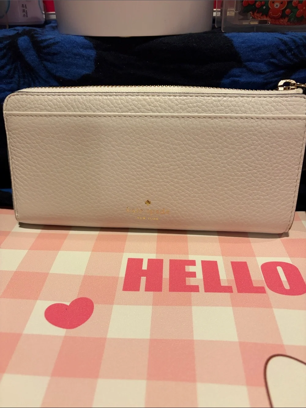 kate spade White Pebbled Leather Zip Wallet with Black Bow and Gold Bar